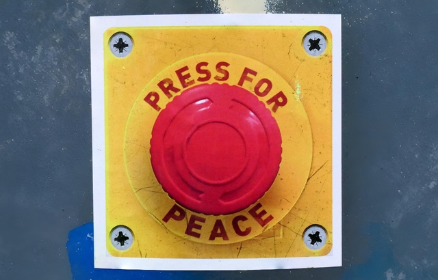 Big red button labeled 'Press for Peace'